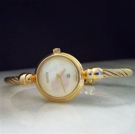 vintage gucci mother of pearl watch|old gucci watch value.